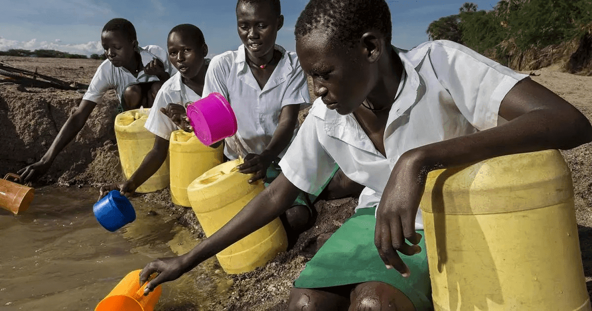 School girls fetch water from a dry riverbed in Lake Turkana is too saline for human consumption.
