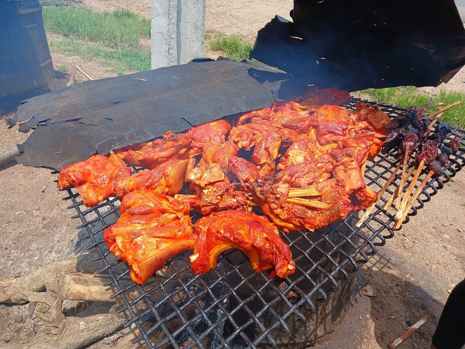The roasting of grasscutters at Asejire bushmeat market in Osun State.