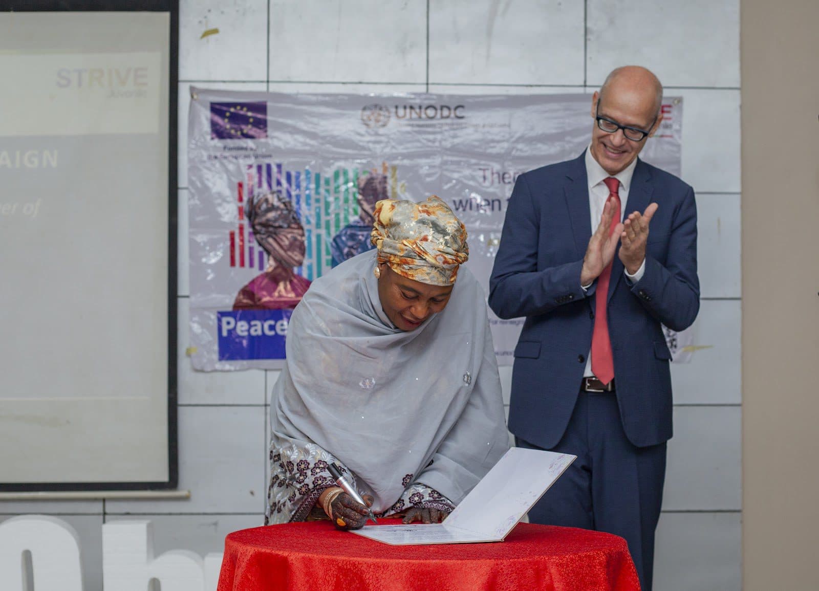 Commissioner Borno State Ministry of Women Affairs and Social Development signed Community Dialogue Structures during the Handing ceremony.