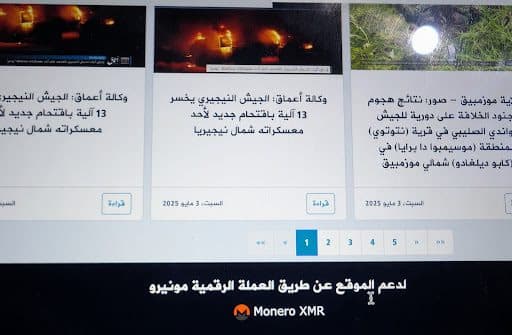 Arabic news website showing articles about military events with images of explosions and text about Monero cryptocurrency support.