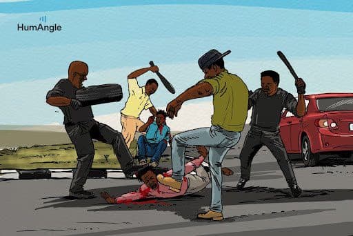 A group of people are attacking a person on the ground with sticks near a red car, while two others watch nearby.
