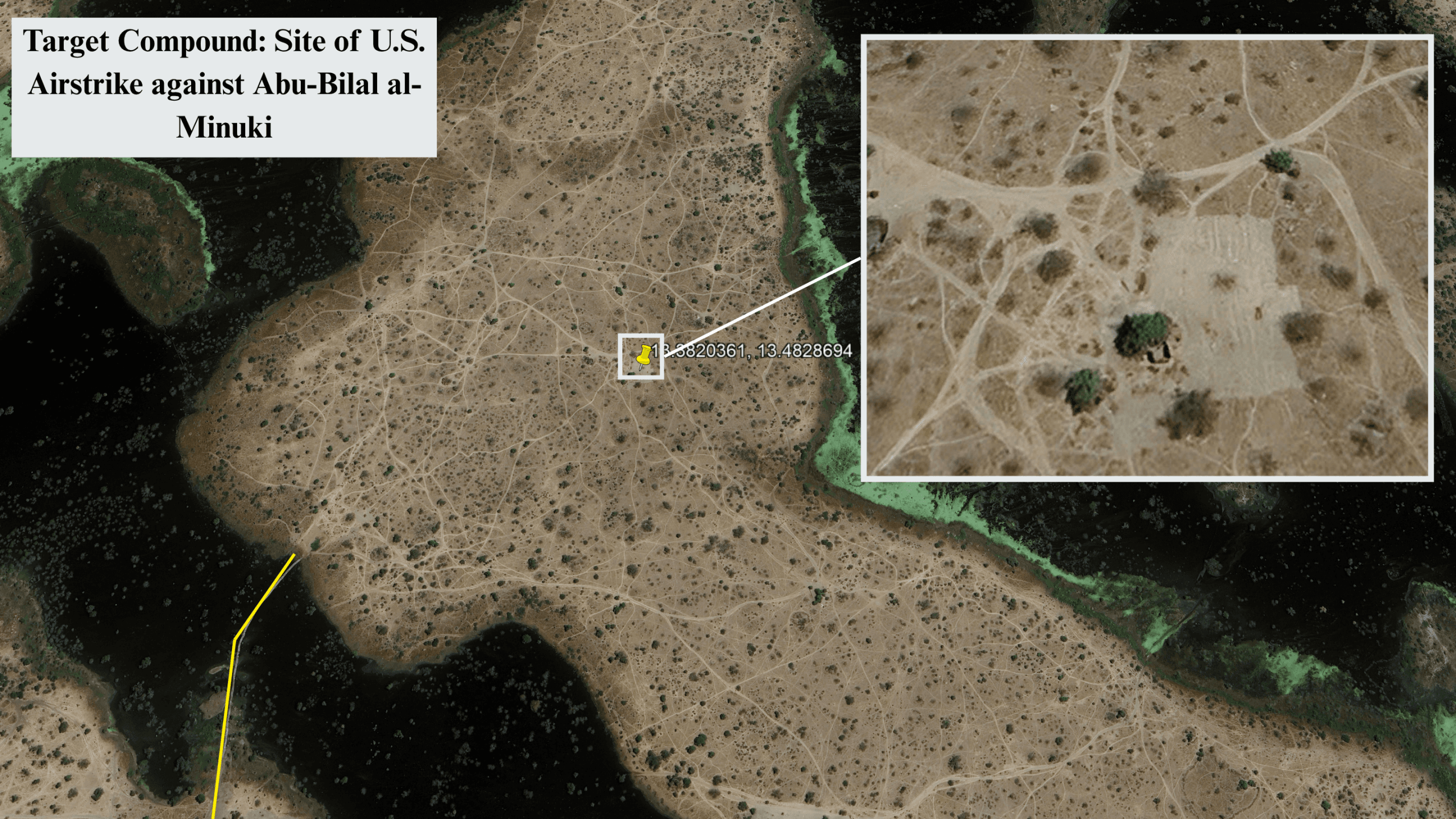 Aerial view of a dry, brown landscape marked as the site of a U.S. airstrike, featuring paths and sparse greenery.