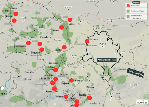 Map of northern Nigeria showing red hotspot markers, green protected areas, and the Militarized Forest.