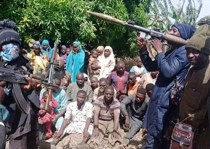 File photo: Terrorists in Niger State brandish heavy arms in front of recent victims of abduction