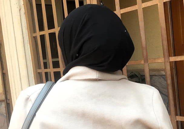 The woman wearing a black hijab has sickle cell anemia.