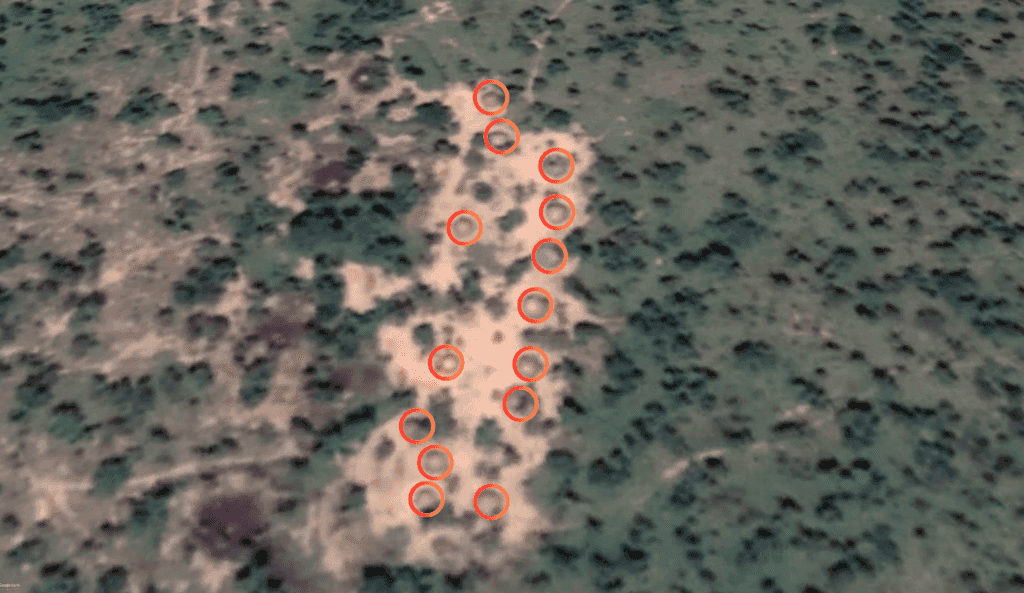 Aerial view of landscape with eleven red circles highlighting specific areas.