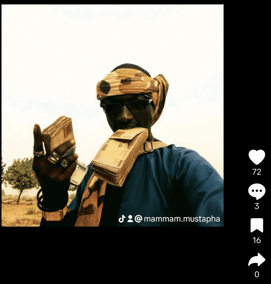 Person in sunglasses and headwrap holding bundles of cash to their face.