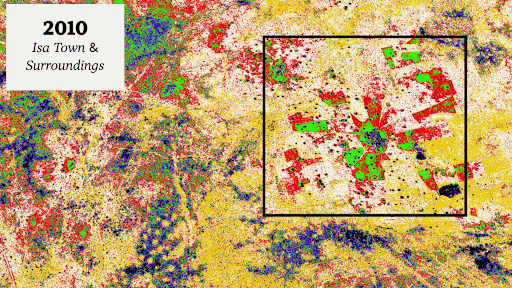 A colorful satellite map showing urban development in Isa Town and surroundings in 2010, with highlighted regions in green and red.