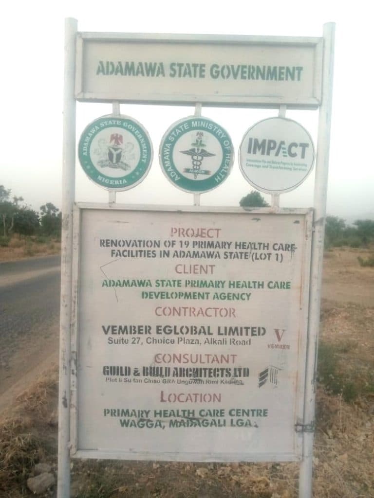 Signboard for Adamawa State Government health project, renovation of 19 primary care facilities, located in Wagga, Madagali LGA.