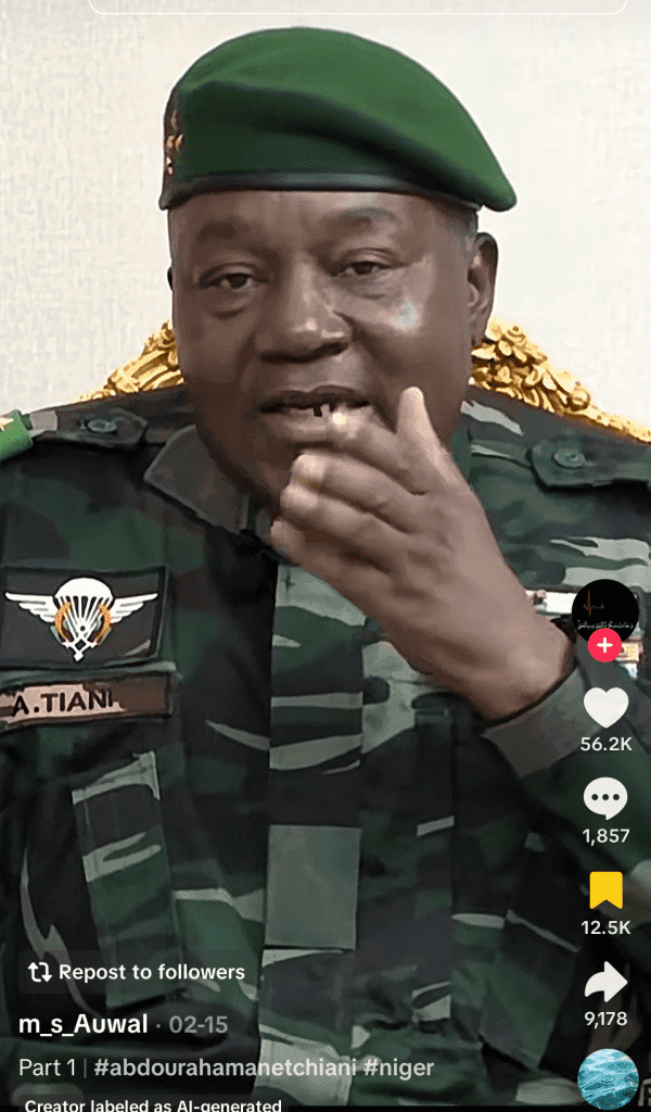 Man in military uniform with green beret speaks, gesturing with his hand. Visible insignia on his chest. Social media interface shown.