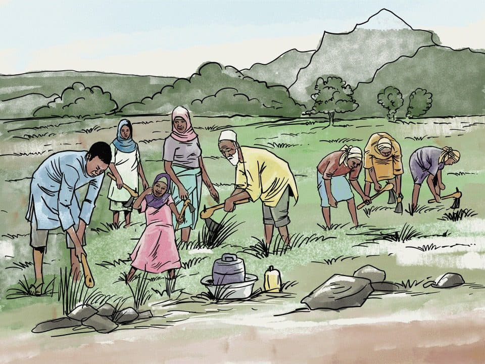 A group of people working together in a field, with tools in hand, surrounded by mountains and trees in the background.